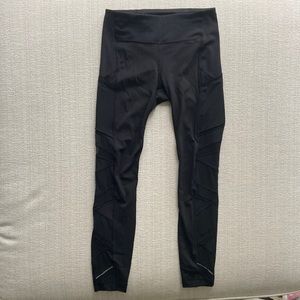 Lululemon black leggings with sheer side panels. EUC size 6